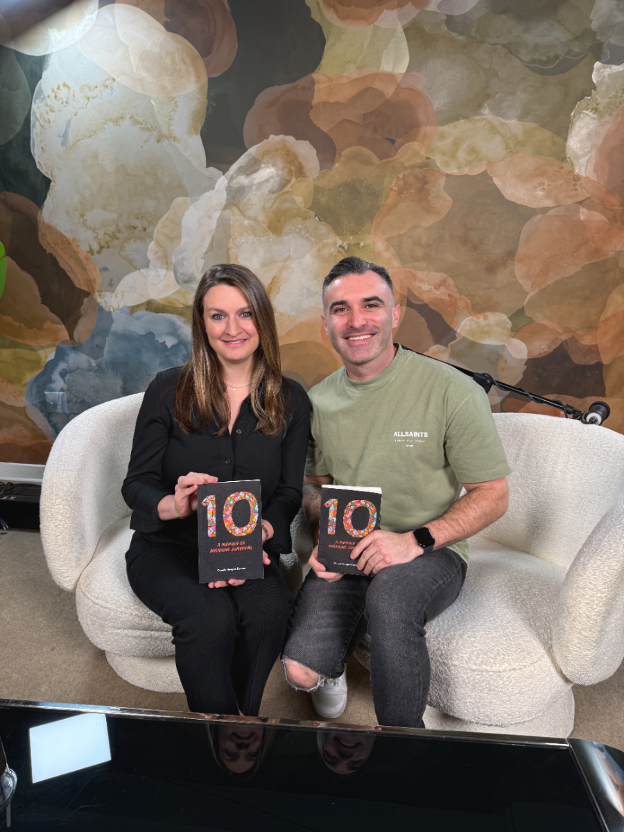 Danielle Newport Fancher and her host seated on a sofa in a podcast studio, each holding a copy of 10